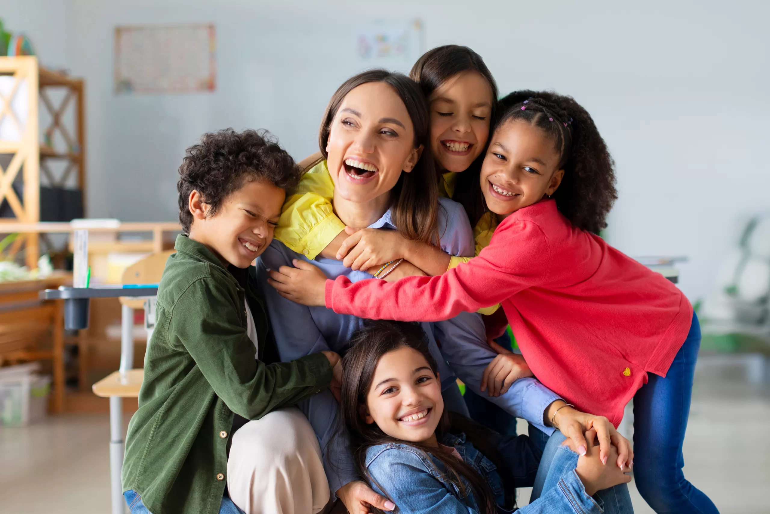 Happy,Diverse,Kids,,Junior,School,Children,Embracing,Female,Teacher,Appreciating Youth life coach certification