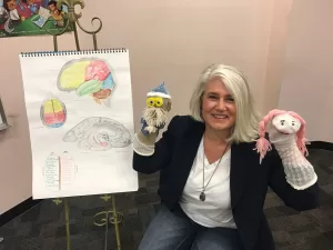 Wisdom coach with puppets