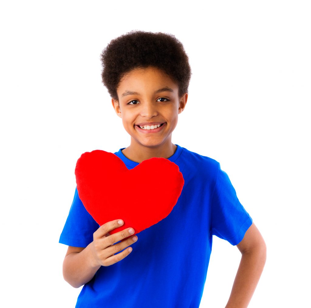 Boy holding a love heart for Adventures in Wisdom 